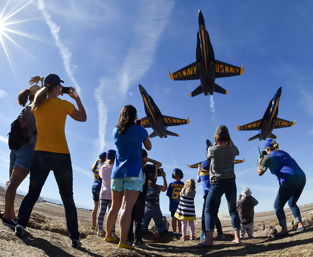 air show blue angels with spectators